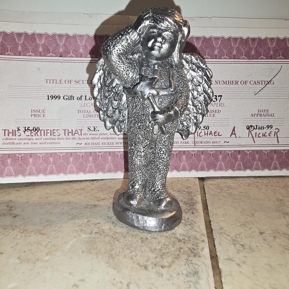 Silver Sculpture with Intricate Textures and Dimensional Depth